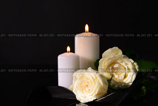 Burning candles, mourning ribbon and flowers on black background. Стоковое фото, фотограф Pixel_shot / Фотобанк Лори