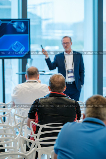 Business seminar with attendees listening to speaker in a modern conference room. Стоковое фото, фотограф Антон Гвоздиков / Фотобанк Лори