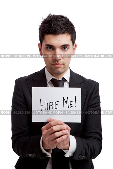 Businessman holding a cardboard with the text Hire Me, isolated on white background. Стоковое фото, агентство Ingram Publishing / Фотобанк Лори