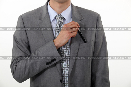Businessman putting a pen in his pocket. Стоковое фото, агентство Ingram Publishing / Фотобанк Лори