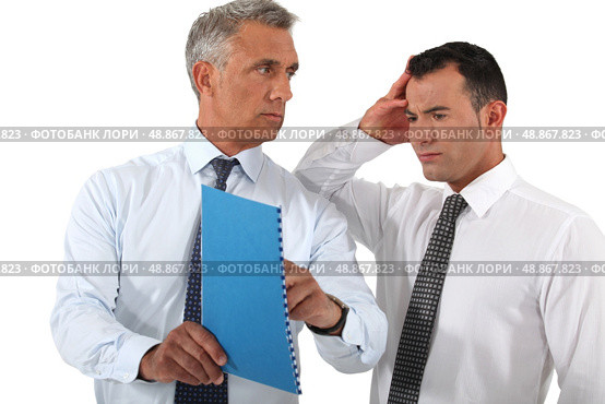 Businessman reprimanding his employee. Стоковое фото, агентство Ingram Publishing / Фотобанк Лори