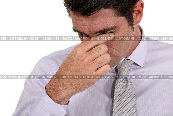 Businessman with a headache. Стоковое фото, агентство Ingram Publishing / Фотобанк Лори
