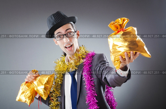 Businessman with sacks of presents. Стоковое фото, агентство Ingram Publishing / Фотобанк Лори