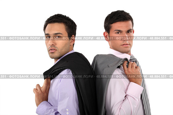 Businessmen standing back to back. Стоковое фото, агентство Ingram Publishing / Фотобанк Лори