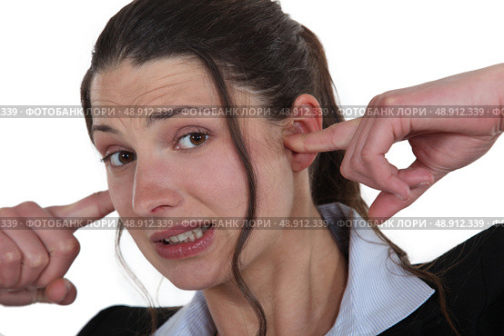 Businesswoman with her fingers in her ears. Стоковое фото, агентство Ingram Publishing / Фотобанк Лори