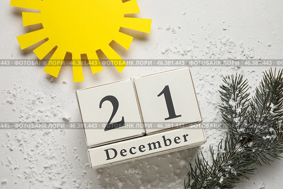 Calendar with date of winter solstice and sun on light background. Стоковое фото, фотограф Pixel_shot / Фотобанк Лори