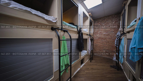 Capsule hotel offering comfortable and affordable sleeping pods. Стоковое фото, фотограф Mikhail Davidovich / Фотобанк Лори