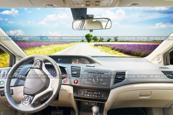 car windscreen with country summer road, view inside out. car windscreen with road. Стоковое фото, агентство Ingram Publishing / Фотобанк Лори
