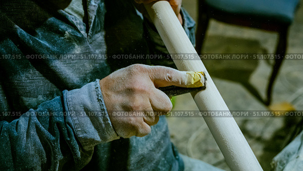 carpenter using nail gun or brad nailer tool on wood box in a workshop ,furniture restoration woodworking concept. selective focus. Стоковое фото, фотограф Feruza Tashmetova / Фотобанк Лори