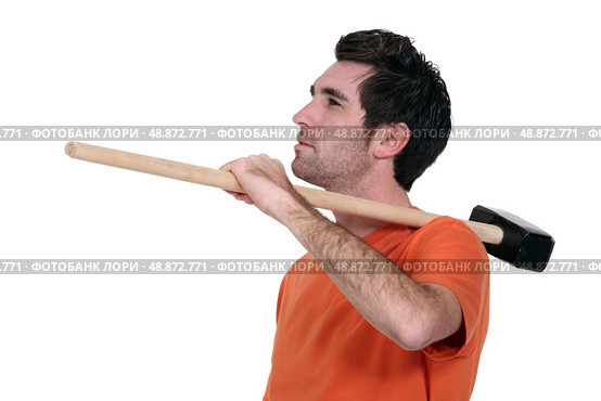Casual man with a sledgehammer. Стоковое фото, агентство Ingram Publishing / Фотобанк Лори