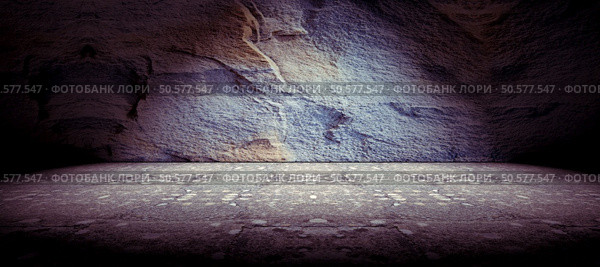 Cement floor and rock wall background and spotlight. Concrete and rock floor background. Стоковое фото, агентство Ingram Publishing / Фотобанк Лори