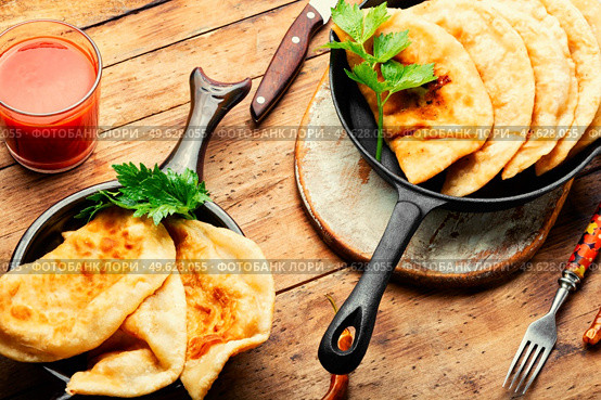 Cheburek, popular and traditional dish of Greek and Tatar cuisine. Fried pies. Non-yeast dough pies with meat filling. Стоковое фото, агентство Ingram Publishing / Фотобанк Лори