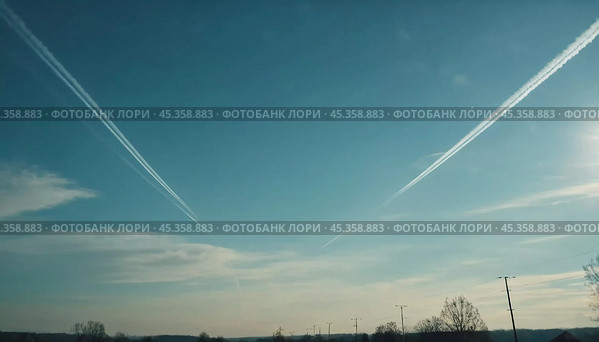Chemtrail conspiracy theory. Long-lasting condensation trails left in sky by high-flying aircraft are actually chemtrails consisting of chemical or biological agents, sprayed for nefarious purposes. Стоковое AI-изображение, AI-художник Юлия Петровская / Фотобанк Лори