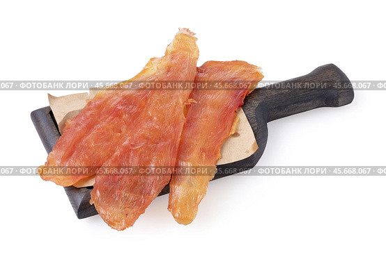Chicken meat chips on a wooden board isolated on white background, sharpness across the object. Стоковое фото, фотограф Сергей Чайко / Фотобанк Лори