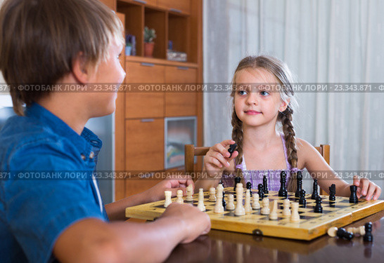 children at chess board indoors. Стоковое фото, фотограф Яков Филимонов / Фотобанк Лори