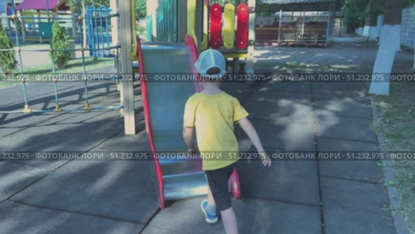 Children Enjoying Fun on a Playground Slide During Playtime Outside in the Sunshine. Стоковое видео, видеограф Olesia Kondrateva / Фотобанк Лори