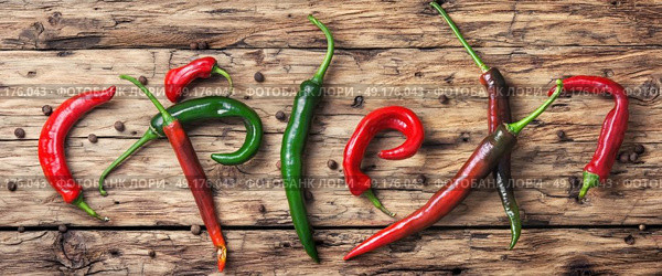 chili cayenne peppers. long poster with mexican hot peppers on old wooden background. Стоковое фото, агентство Ingram Publishing / Фотобанк Лори