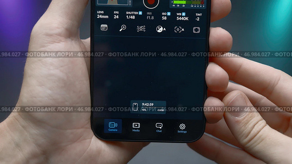 China, Beijing - September 15, 2023: Setting up camera of new iPhone 15 pro. Редакционное фото, фотограф David Kashakhi / Фотобанк Лори