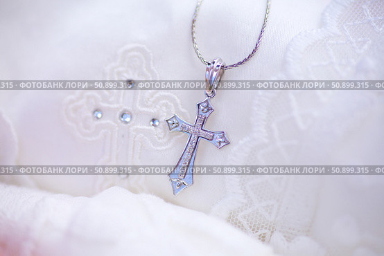 Christian cross to wear on the body after baptism. Стоковое фото, фотограф Наталия Кирсанова / Фотобанк Лори