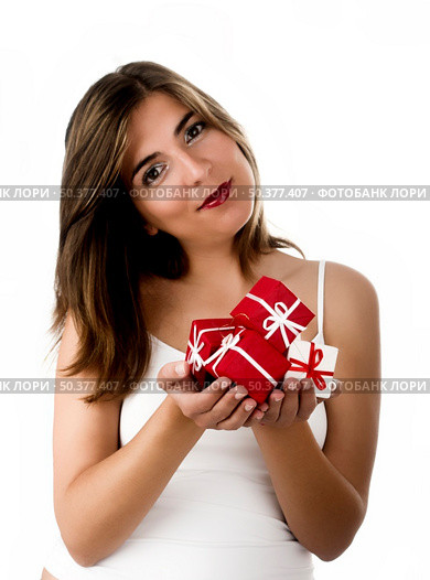 Christmas season! Different poses of a beautiful woman with small gifts on the hands.  (Focus is on the gifts) Стоковое фото, агентство Ingram Publishing / Фотобанк Лори