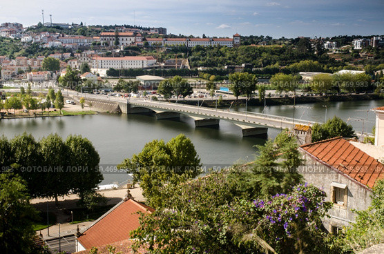 City panorama of Coimbra, Portugal and the river Mondego. Стоковое фото, агентство Ingram Publishing / Фотобанк Лори