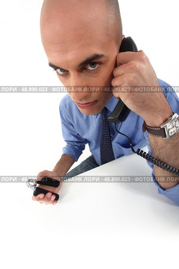 Civil servant squeezing hand grippers. Стоковое фото, агентство Ingram Publishing / Фотобанк Лори