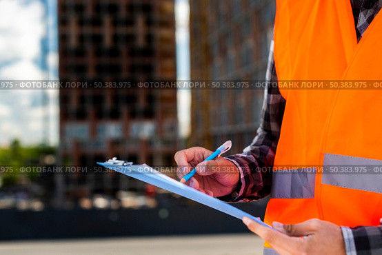 close up construction engineer writing. Стоковое фото, агентство Ingram Publishing / Фотобанк Лори