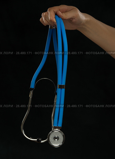 Close-up of female doctor holding stethoscope , focus on stethoscope. Стоковое фото, фотограф Kirill Kedrinskiy / Ingram Publishing / Фотобанк Лори