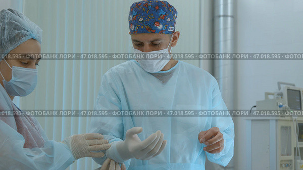 Close up of surgery performed by professional specialists. Стоковое фото, фотограф David Kashakhi / Фотобанк Лори