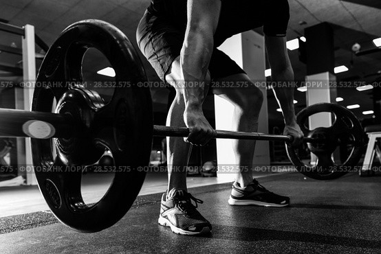 Closeup of weightlift workout at the gym with barbell. Man wearing sportswear clothes. Стоковое фото, фотограф Javier Sánchez Mingorance / Ingram Publishing / Фотобанк Лори