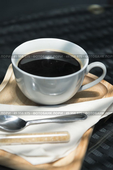 Coffee cup and saucer on old wooden table. Стоковое фото, агентство Ingram Publishing / Фотобанк Лори