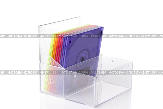 Color floppy disks in box isolated on white. Стоковое фото, агентство Ingram Publishing / Фотобанк Лори