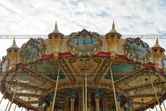 Colorful city carousel for children. Touristic concepts in Nouvelle Aquitaine. Time to get fun with children. 2019. Редакционное фото, фотограф YuryKara / Фотобанк Лори