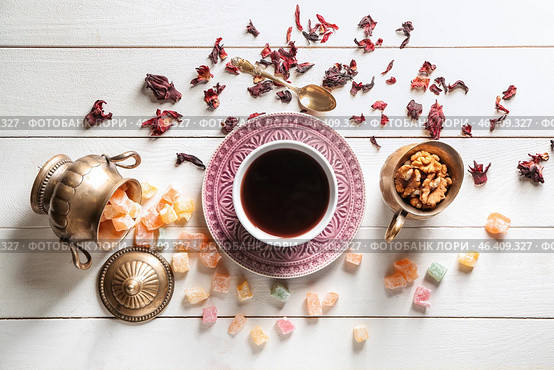 Composition with cup of tea and rahat lakoum on white wooden table. Стоковое фото, фотограф Pixel_shot / Фотобанк Лори