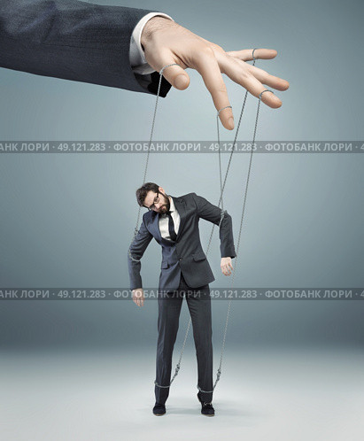 conceptual photo of a boss pulling the strings. Стоковое фото, агентство Ingram Publishing / Фотобанк Лори