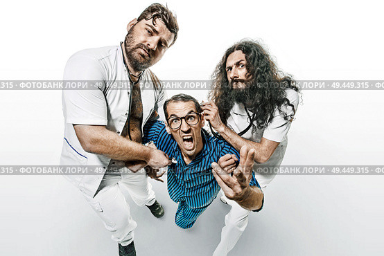Conceptual portrait of funny doctors and patient in the madhouse. Стоковое фото, агентство Ingram Publishing / Фотобанк Лори