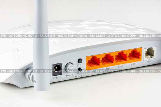 Connectors, control buttons. lan and adsl ports on a new white Wi Fi router with gray antennas on a white background close-up. Стоковое фото, фотограф Андрей С / Фотобанк Лори