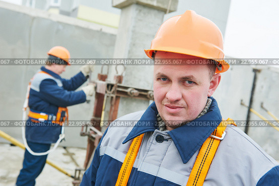 Construction worker. Builders concreter joiners at work. Стоковое фото, фотограф Дмитрий Калиновский / Фотобанк Лори