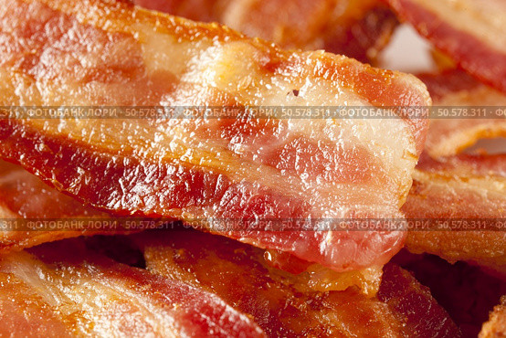 Cooked Greasy Bacon against a back ground. Стоковое фото, агентство Ingram Publishing / Фотобанк Лори
