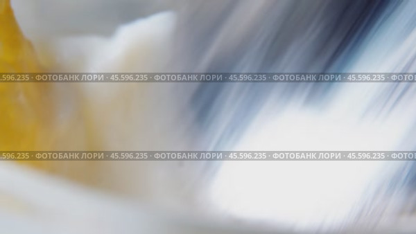 Cornflakes are poured into a jar with yogurt, stirred and the resulting mixture is scooped with a spoon. Стоковое видео, видеограф Ярославский Максим / Фотобанк Лори