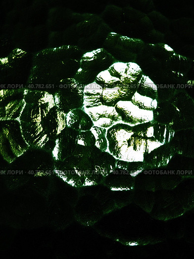 Corrugated green glass background. Abstract translucent volumetric texture pattern on the surface of a window. Liquid horror or planet Solaris. Night or space theme. Стоковое фото, фотограф Юлия Петровская / Фотобанк Лори