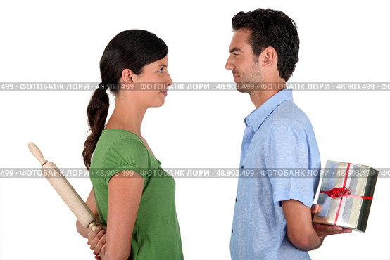 Couple stood facing each other. Стоковое фото, агентство Ingram Publishing / Фотобанк Лори