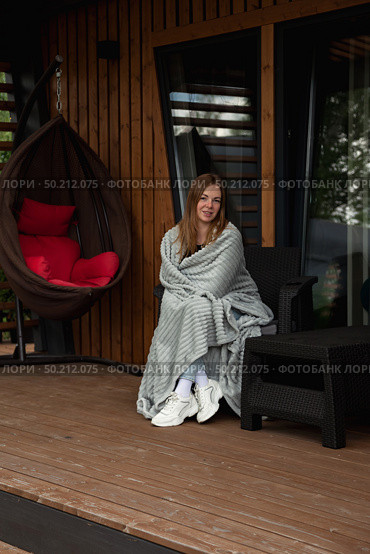 Cozy Retreat Woman Enjoying Quiet Morning at a Country House. Стоковое фото, фотограф Aleksandr Golubev / Фотобанк Лори