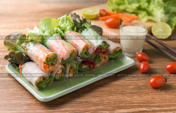 crab stick salad roll on wood background. Стоковое фото, агентство Ingram Publishing / Фотобанк Лори