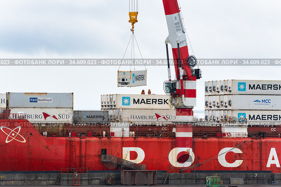 Crane unloading Russian container ship Sevmorput Rosatomflot - nuclear-powered icebreaker lighter aboard ship carrier (2019 год). Редакционное фото, фотограф А. А. Пирагис / Фотобанк Лори