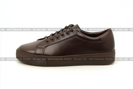 Dark brown leather lace-up running shoes with low tops, thick soles. The laces and black rubber outsole. Sporty look. Men to wear during outdoor activities, hiking. Brown shoes. Trendy Male Boots Pair. Стоковое AI-изображение, AI-художник Марина Демидюк / Фотобанк Лори