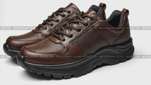 Dark brown leather lace-up running shoes with low tops, thick soles. The laces and black rubber outsole. Sporty look. Men to wear during outdoor activities, hiking. Brown shoes. Trendy Male Boots Pair. Стоковое AI-видео, аниматор Марина Демидюк / Фотобанк Лори