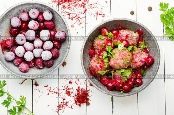 Delicious kufta or lamb meatballs in cherry sauce. Syrian kyufta with cherry. Стоковое фото, агентство Ingram Publishing / Фотобанк Лори