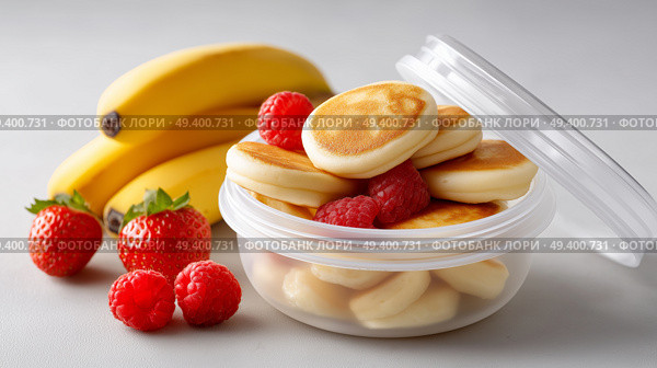 Delicious mini pancakes surrounded by fresh fruit at breakfast time. Вкусные мини-блинчики в окружении свежих фруктов во время завтрака. Стоковое AI-изображение, AI-художник Katsiaryna Repich / Фотобанк Лори