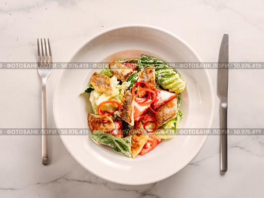 Delicious salad with fried baked smelt fish. Стоковое фото, фотограф Ольга Сергеева / Фотобанк Лори